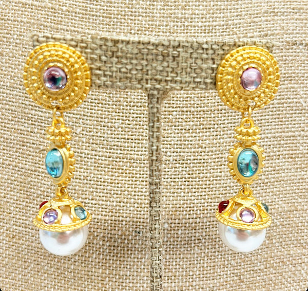 Larger pierced faux pearl statement earrings.