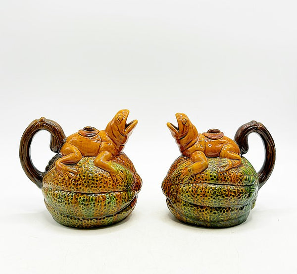 Pair of matching vintage majolica style frogs on melons style teapots with lids.