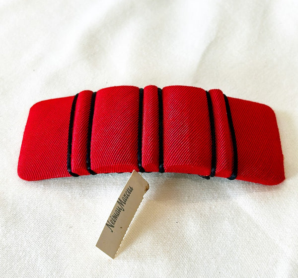 Vintage red fabric designer hair barrette from Neiman’s with tag still attached.