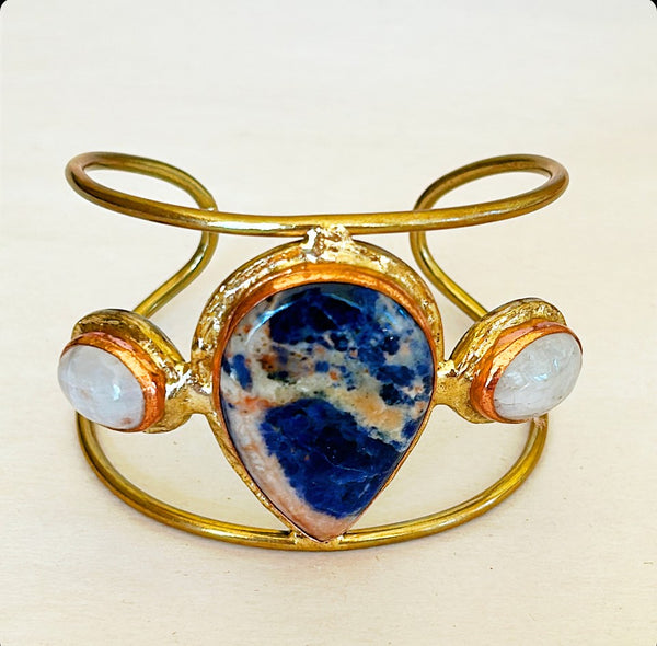Modern style designer cuff with brass frame with sodalite stone mixed with moonstones.