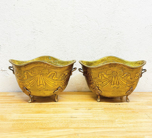 Fabulous pair of matching solid brass vintage footed planters.