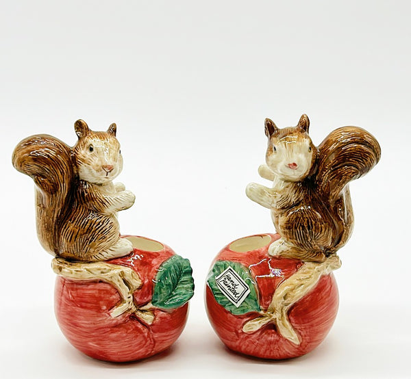 Pair of 1990 stamped OCI (sister company of Fitz & Floyd) squirrel candlestick holders.