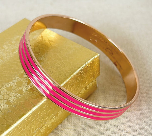 Vintage signed Oscar De La Renta pink enamel bs fake bracelet with gold metal trim - signed on the inside