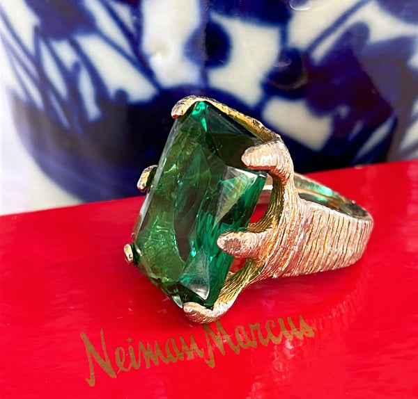 Amazing large scale cocktail ring with large center green emerald style stone set an aged washed silver gold style metal setting