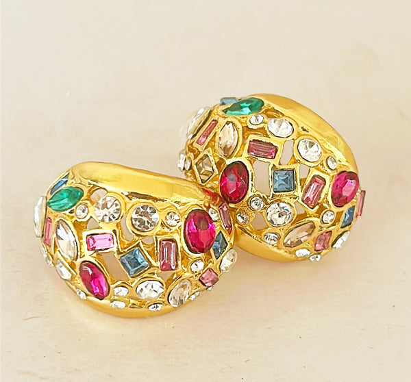 Beautiful half dome shaped pierced style earrings in a gold tone metal and multi colored stone & gripoix style accents.