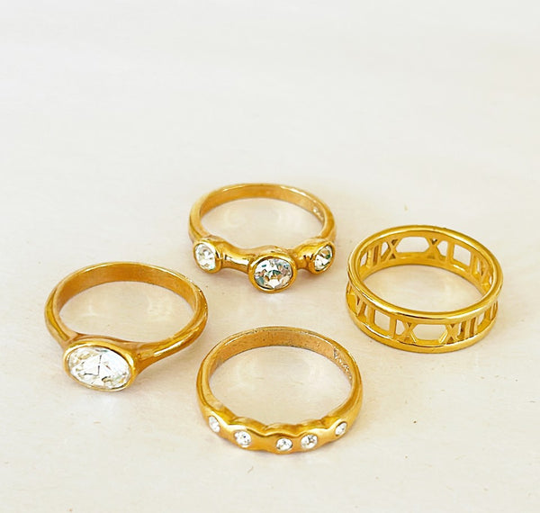 Collection of 4 designer style rings