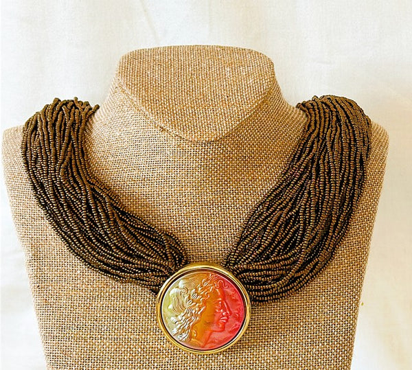 Beautiful statement necklace with large Caesar Intaglio style center pendant.