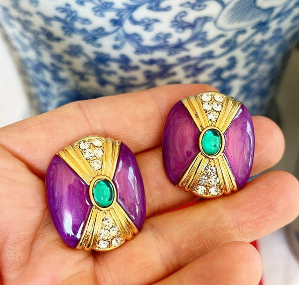 Beautiful statement style large, oval shaped pierced designer earrings.