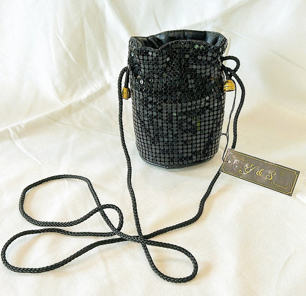 Vintage black metal mesh evening bag with fabric cord style strap.
