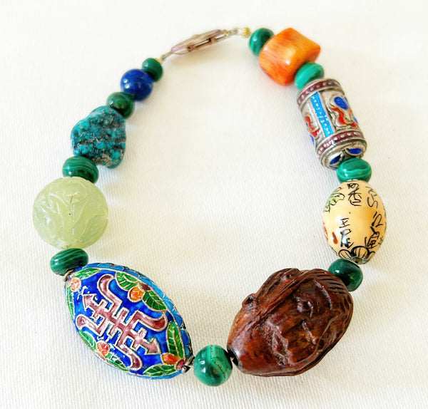 Amazing rare asian style stone bracelet mixed cloisonné beads. Wooden carved Asian style face bead with malachite, lapis, coral turquoise & ja