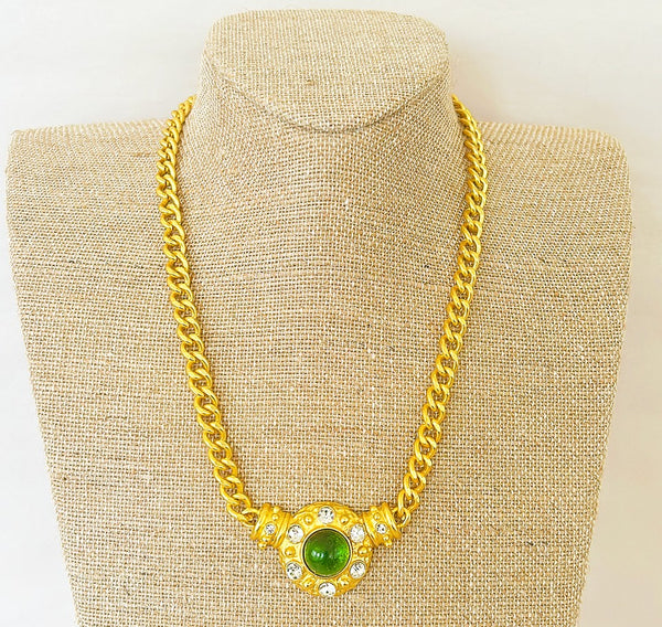Amazing statement gold tone metal link necklace with green gripoix style center pendant with rhinestone accents.