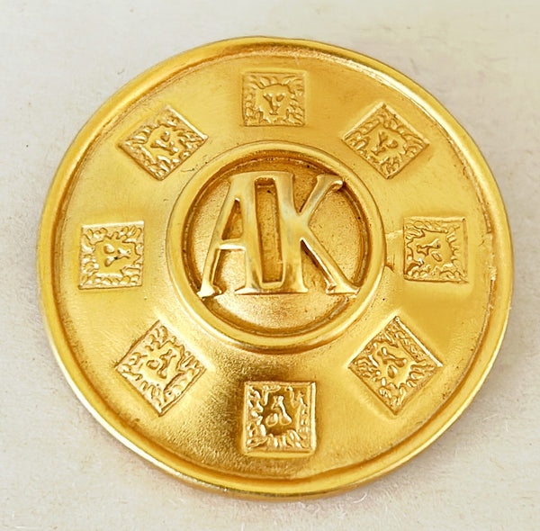 Classic signed AK Anne Klein signature round designer brooch.