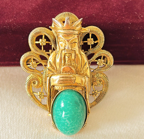 1960 vintage Asian brooch with oval faux jade stone detail.