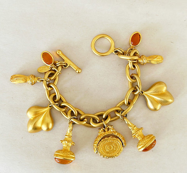 1980s Signed Maxine Denker couture style charm bracelet.