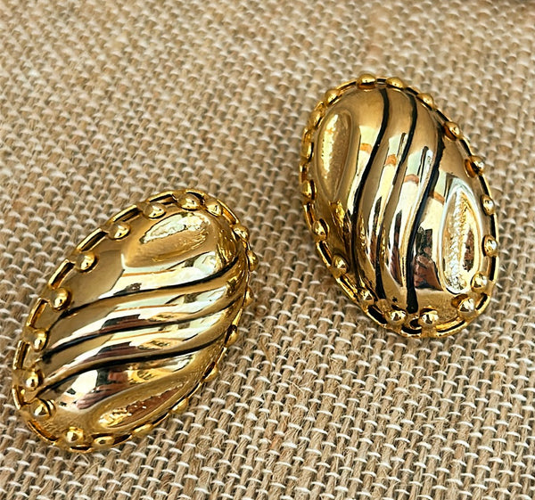 1990s oval vintage larger oval gold metal dome clip on earrings.