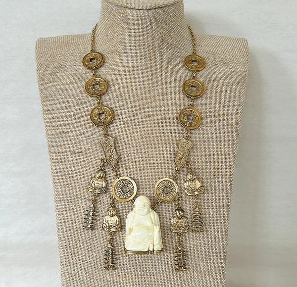 Vintage mid century modern 1960s signed Trifari Chinese faux carved Buddha coin necklace.