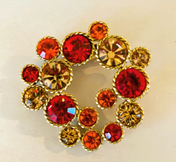 90s vintage faux gemstone brooch set in a gold tone metal finish frame