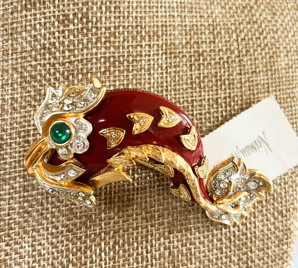 Vintage 1980s signed Erwin Pearl designer, statement, piece, dolphin style branch with rhinestones in a green cabochon eye.