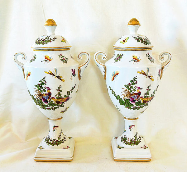Pair of 19th century Limoges signed neoclassical urns with lids.