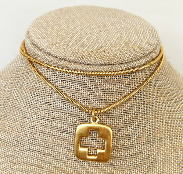 1970s signed Anne Klein chain necklace with square cross cut open pendant.