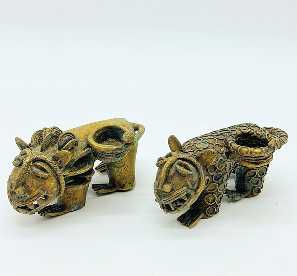Pair of vintage mid-century modern brass lion & leopard candlestick holders.