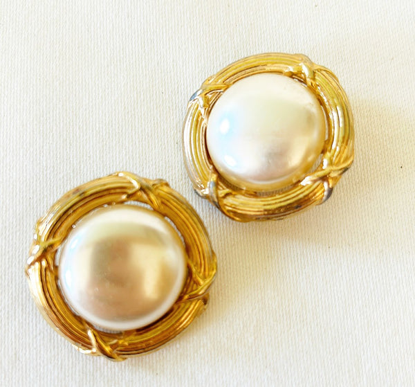 Classic clip on big pearl earrings with classic style gold metal trim.
