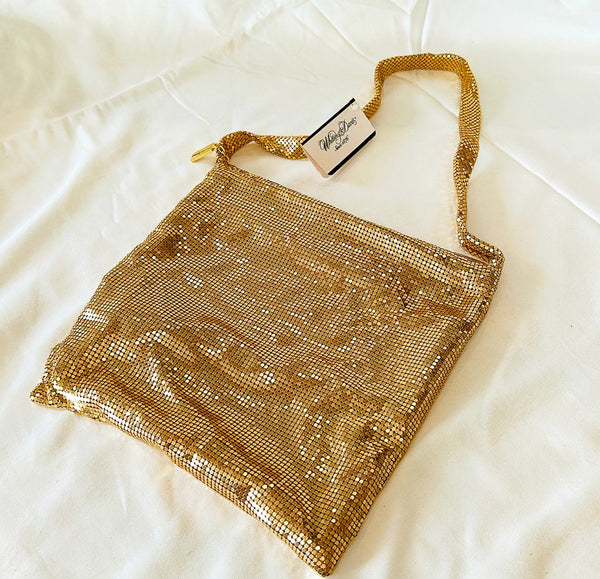 Vintage stamped Whiting & David gold metal mesh style hand bag.