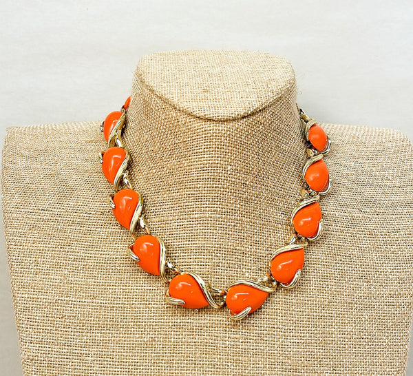 Vintage 60s Coro coral orange necklace with gold metal accents.