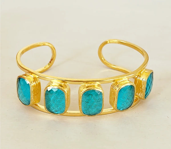 Cuff bracelet in a gold tone metal finish