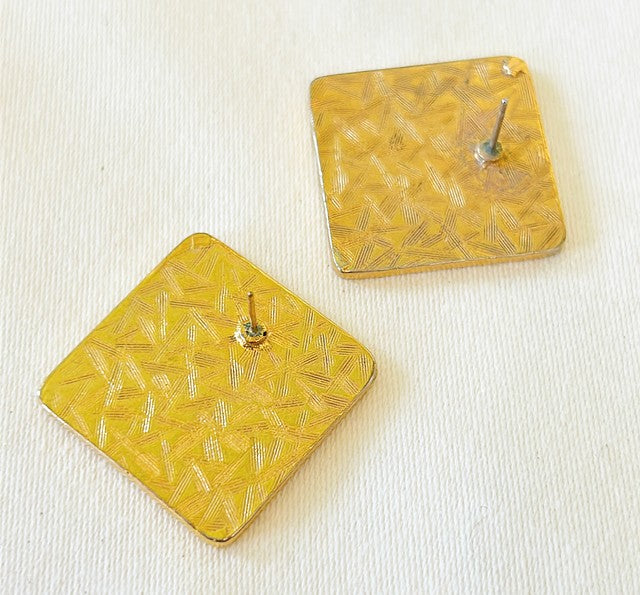 Vintage 1980s classic Anne Klein square medallion signature lion head earrings.