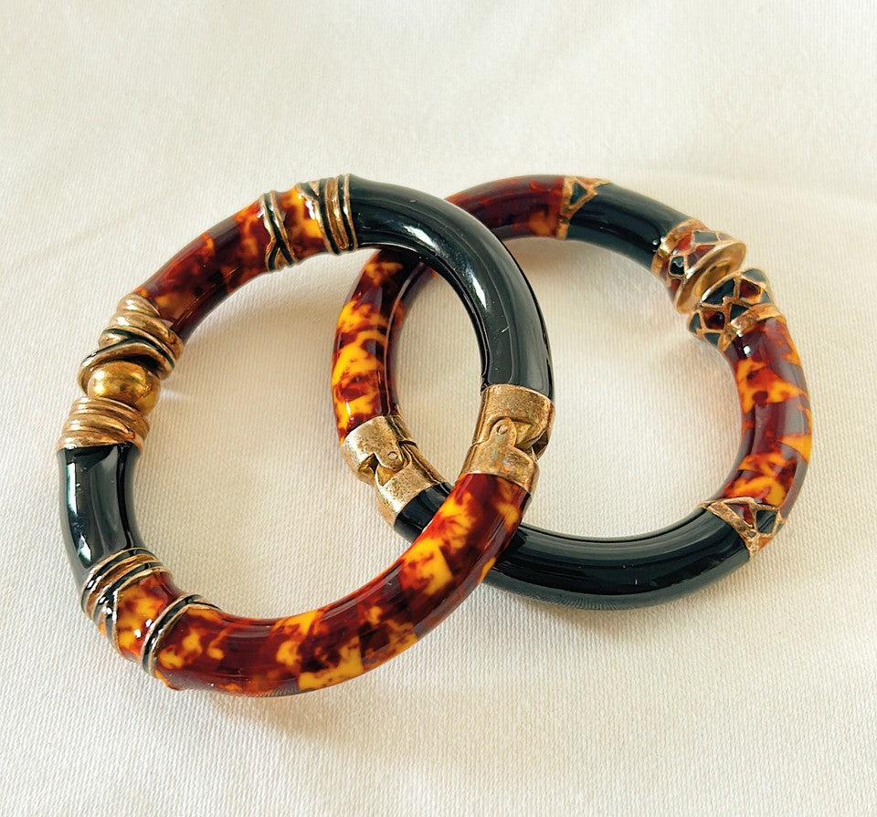 Vintage 1970s Italian made enamel tortoise and black hinged bangle bracelets.