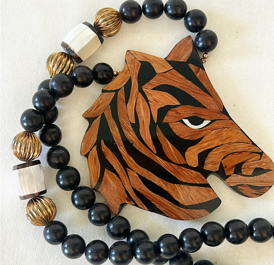 How fun is this? 1980s designer style black beaded necklace with wooden carved lacquered zebra pendant.