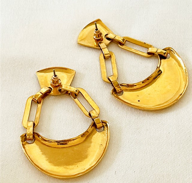 Large statement size pierced 80s earrings. Glamours look