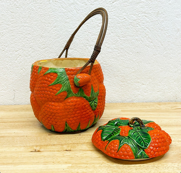 1940s strawberry box with lid and rattan handle.