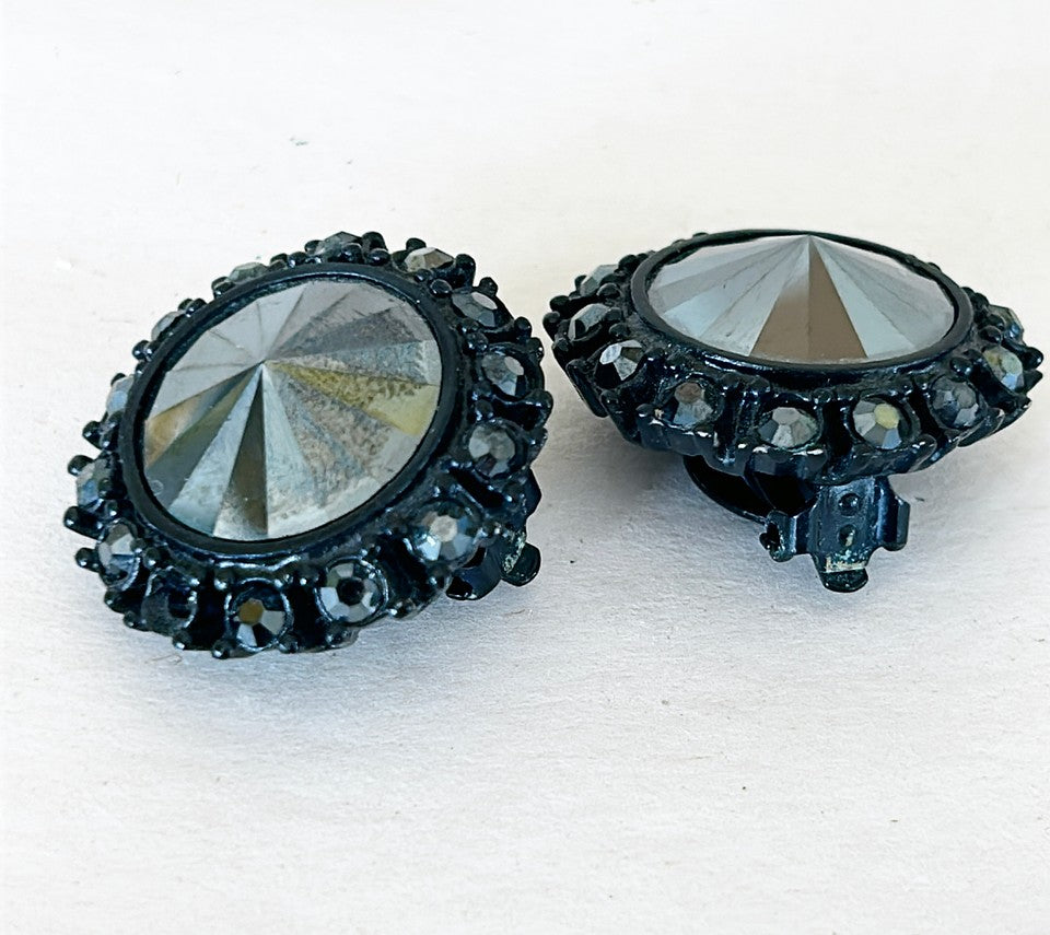 Signed St. John Rare jet back crystal clip on earrings.
