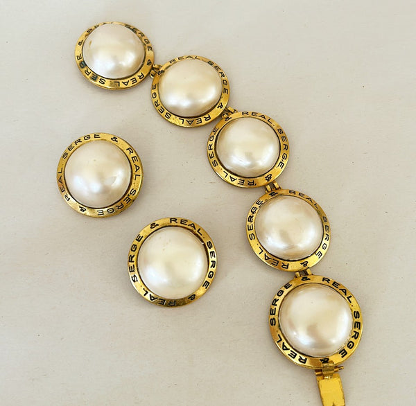 1980s statement designer clip on earrings with matching large cocktail bracelet.