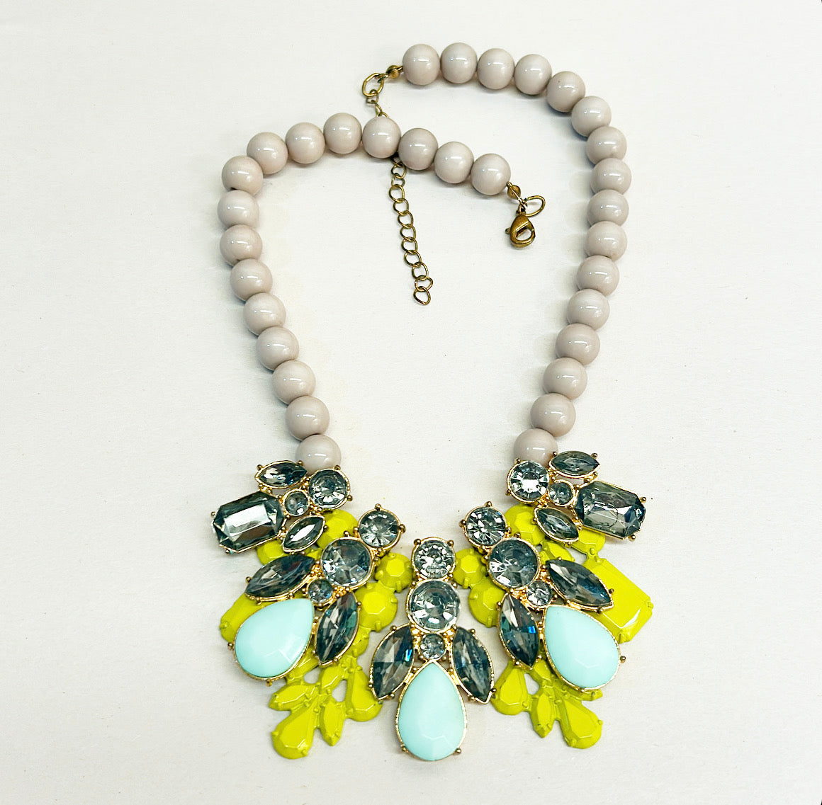 Vintage statement necklace with gray beaded details.