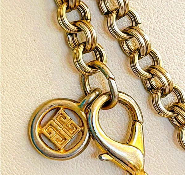 Fabulous rare 1970s signed Givenchy long heart charm pendant necklace.