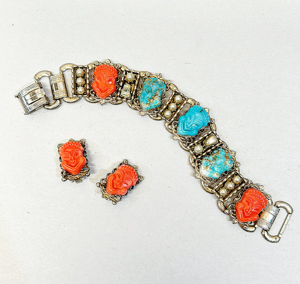 Mid-century 60s Asian style carved faces link style bracelet with matching clip on earrings.