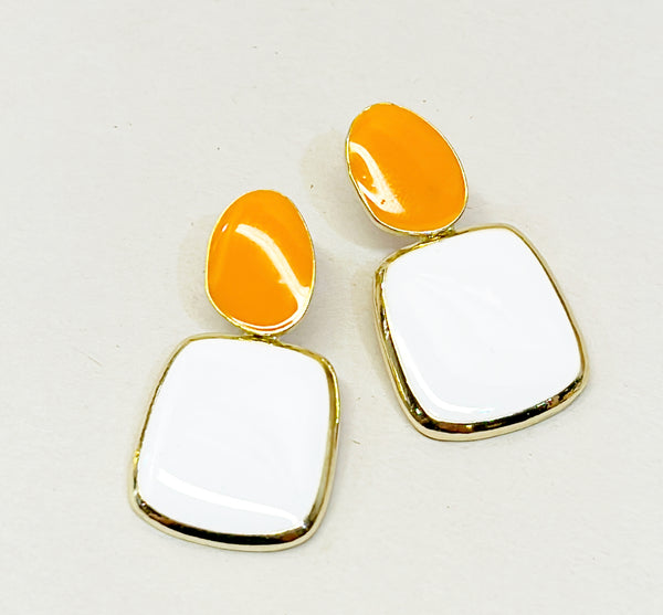 Fun cloth block style pierced earrings set in a gold metal frame settings with orange &amp; white enamel accents