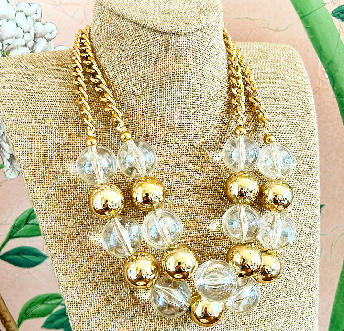 Large chunky statement necklace with double layers of clear acrylic beads mixed with gold metal metal beads