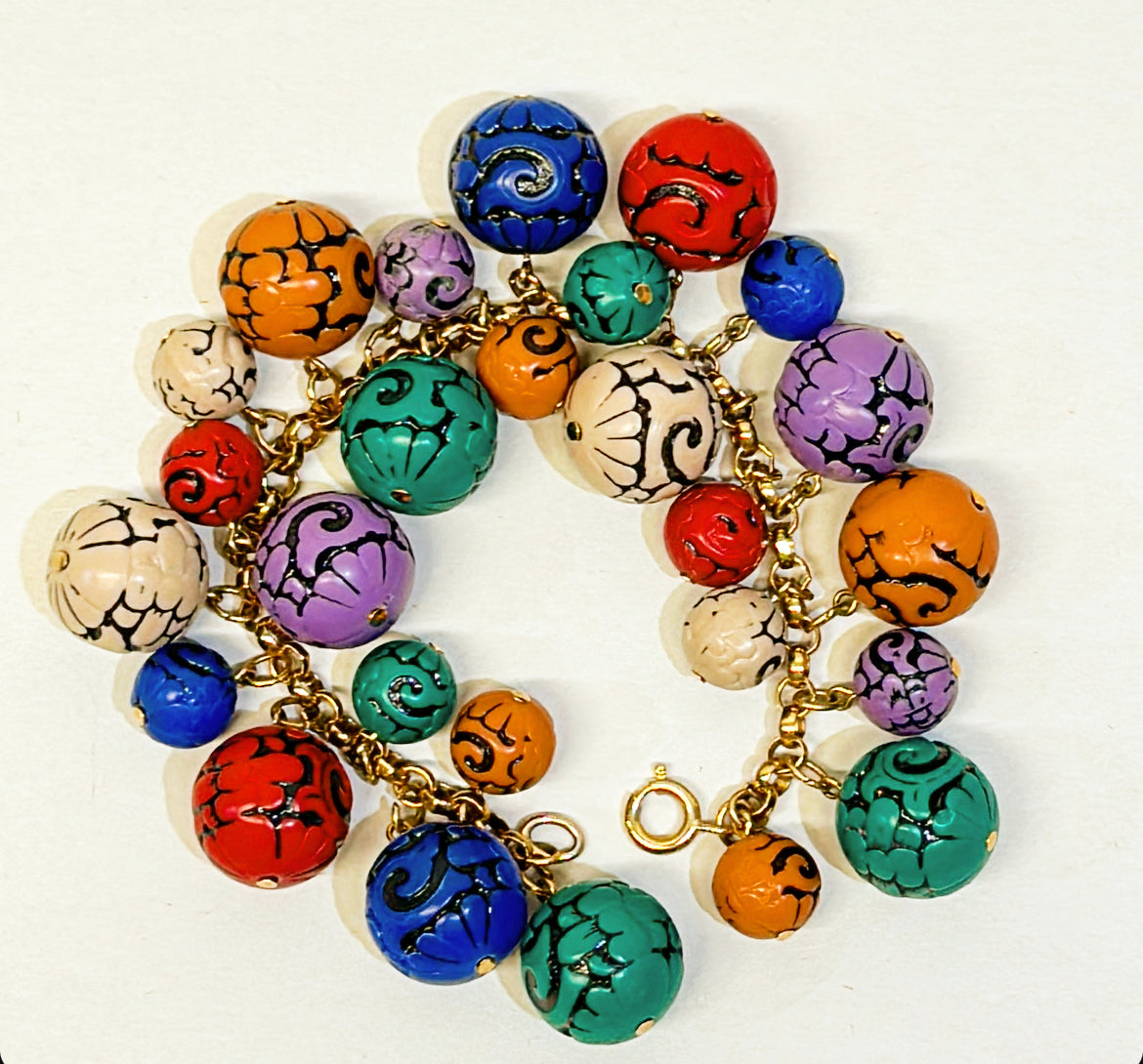 Mid century side multi colored cluster style charm bracelet.
