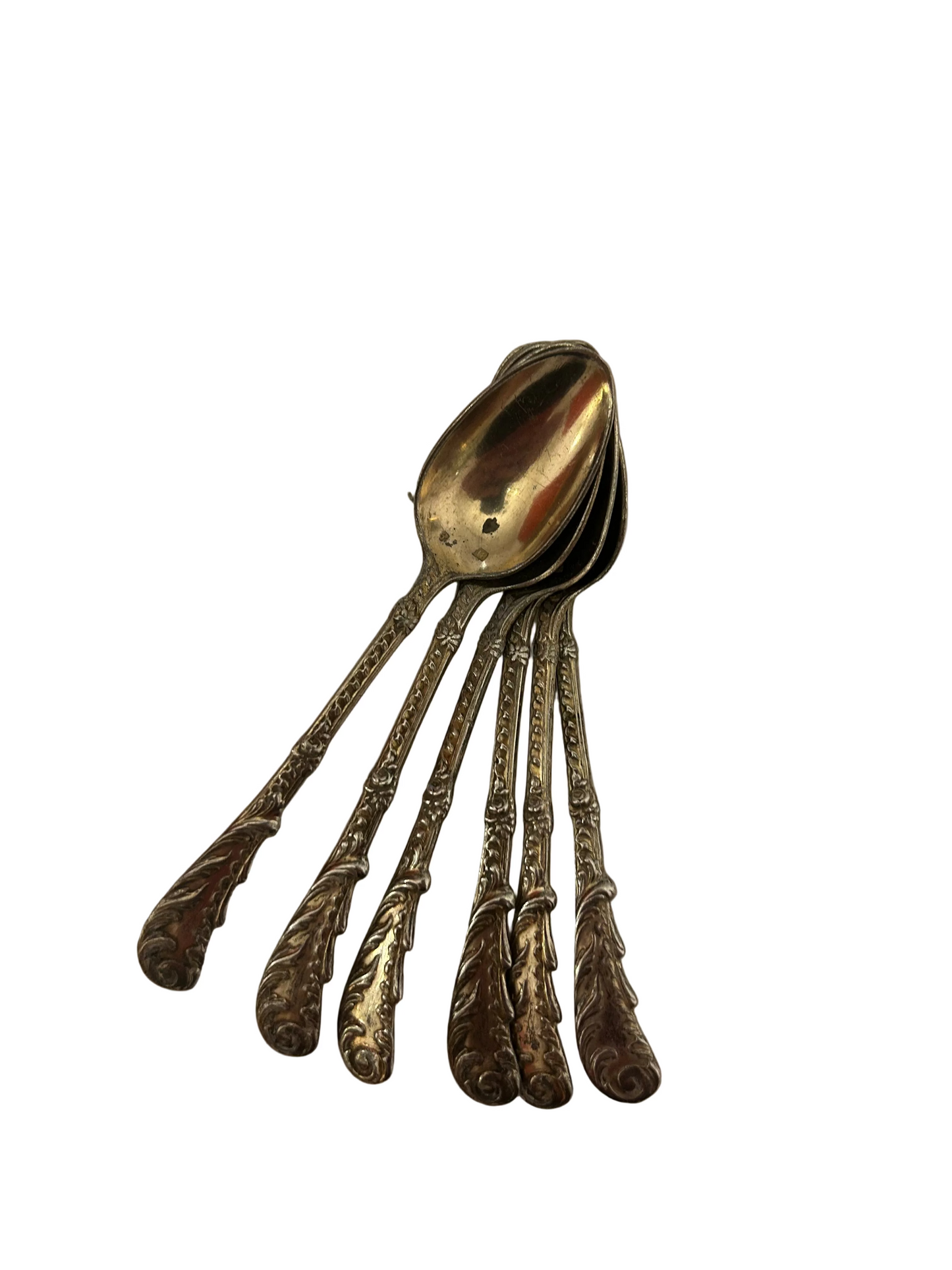 vintage silver flatware spoons featuring a highly ornate, Baroque-style scroll pattern on the handle
