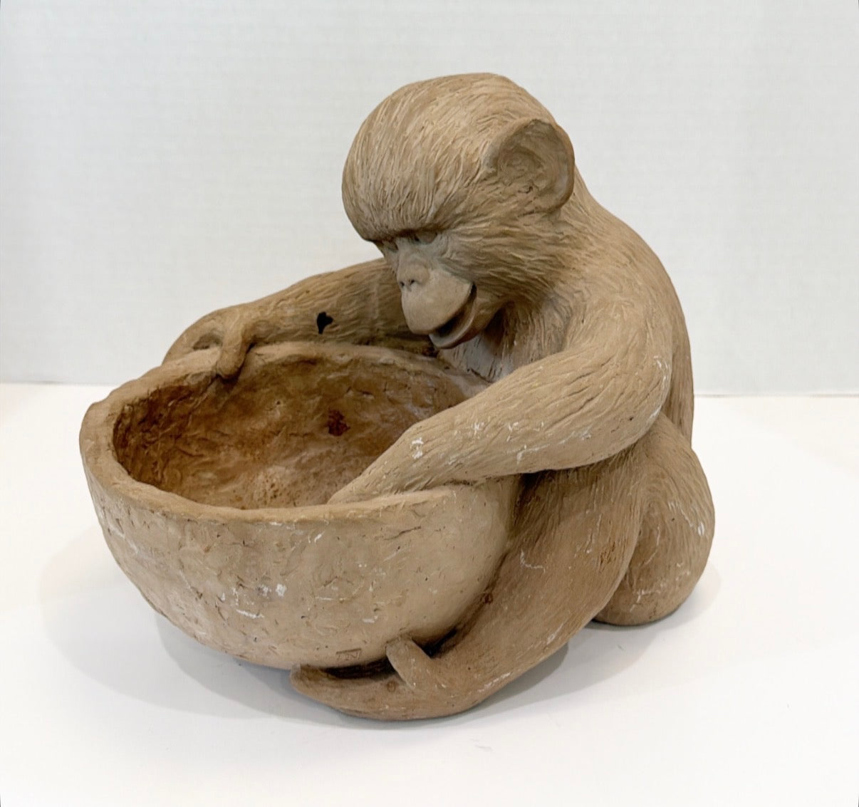 Vintage monkey with a bowl