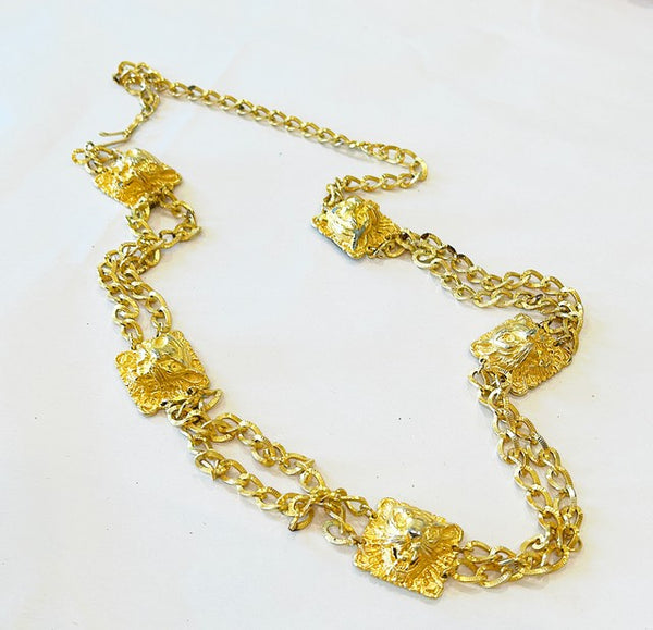 Vintage 80s fashion designer gold chain necklace with lion head accents.