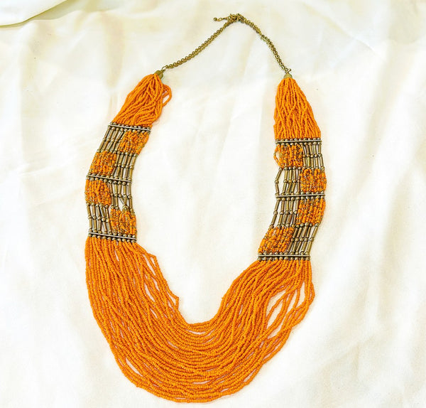 Fabulous large statement piece orange beaded vintage necklace with multi strands.