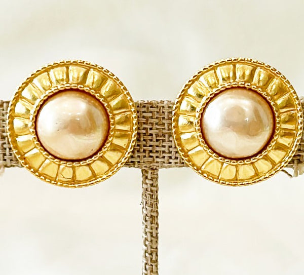 Classic vintage fashion designer earrings with faux pearl centers.