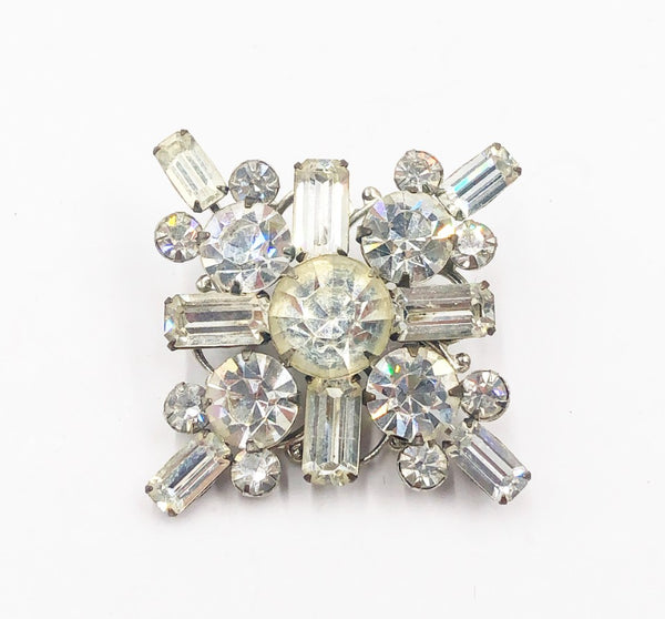 Vintage 60s fashion brooch with silver tone base with clear rhinestones.