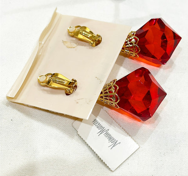 Large scale statement clip on vintage designer earrings by St. John for Neiman Marcus.