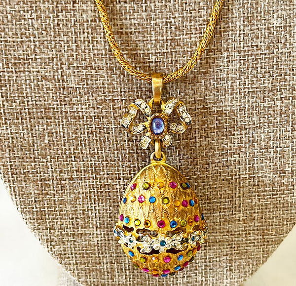 Beautiful vintage fashion designer necklace with decorated egg pendant with bow